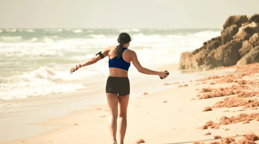 Woman training with a personal trainer in a bright studio near Nai Harn, Phuket